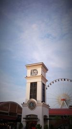 Low angle view of clock tower against clear sky