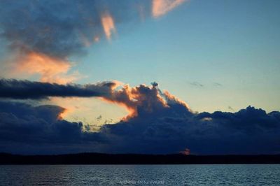 Scenic view of sea against cloudy sky