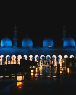 Reflection of illuminated building in water