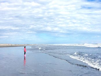 Scenic view of sea against cloudy sky