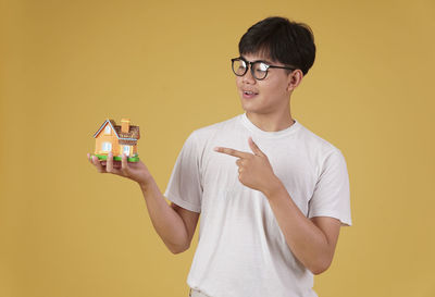 Full length of a boy holding camera