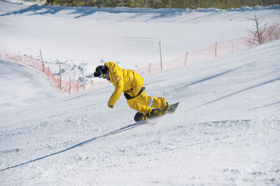 Man skiing on mountain during winter