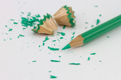 Close-up of colored pencils against white background