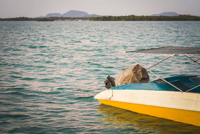 Boat anchored with sunrise lights overlooking the bum bum island in semporna, borneo sabah.