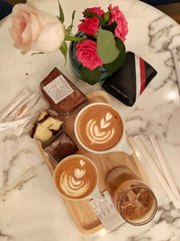 High angle view of coffee roses on table