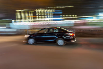 Blurred motion of car on road at night