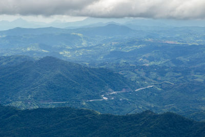 Aerial view of mountain range against sky