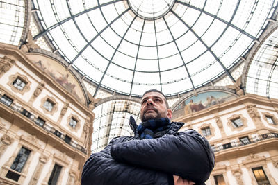 Low angle view of man in galleria vittorio emanuele ii