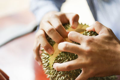 Midsection of couple holding hands