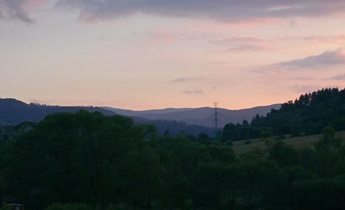 Scenic view of landscape against sky at sunset