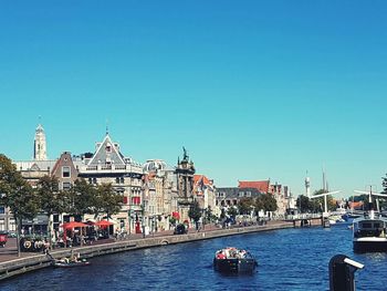 Boats moored at harbor