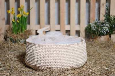 Close-up of wicker basket on field