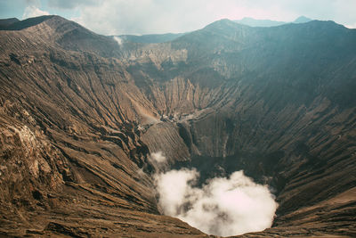 High angle view of volcanic mountain against sky
