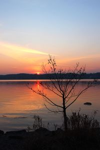 Scenic view of sea against sky at sunset