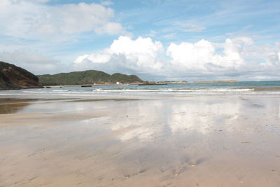 Scenic view of beach against sky