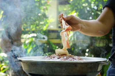 Close-up of person preparing food in bowl