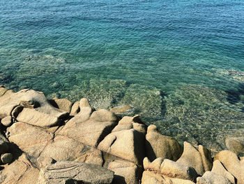 High angle view of rocks in sea