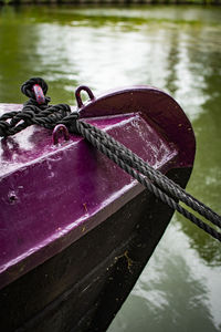 Close-up of rope on boat moored at lake
