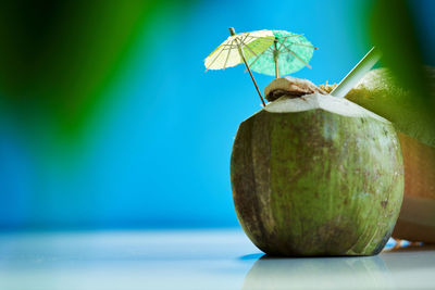 Straw hat ,coconut drink decorated with mini umbrella and straw