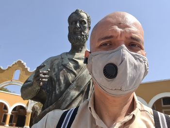 Portrait of man statue against clear sky