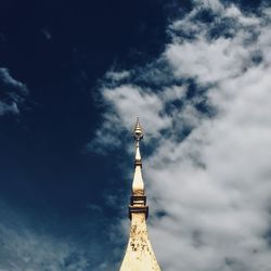 Low angle view of tower of building against cloudy sky