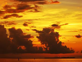 Scenic view of sea against orange cloudy sky