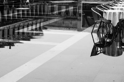 Bicycle parked on footpath against building in city