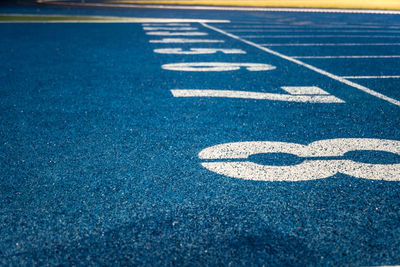 High angle view of arrow sign on road