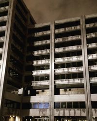 Low angle view of illuminated building at night