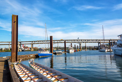 Boats moored at harbor