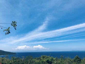 Scenic view of sea against blue sky