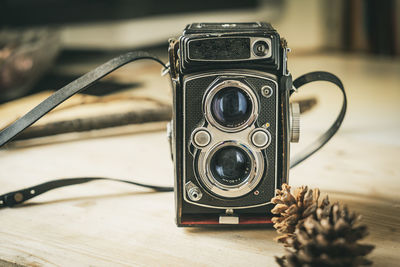 Close-up of camera on table