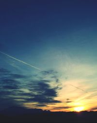 Scenic view of landscape against sky at sunset