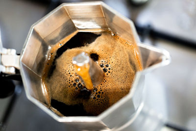 Strong fresh coffee made in italian style cafetiere. selective focus on coffee. 