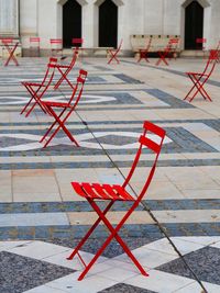 Red umbrella on footpath