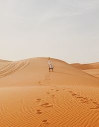 Scenic view of desert against clear sky