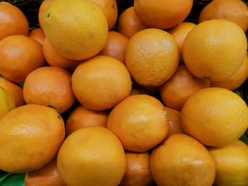 Full frame shot of oranges at market stall