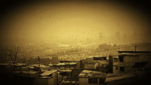 Aerial view of cityscape against sky