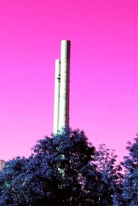 Low angle view of smoke stack against sky