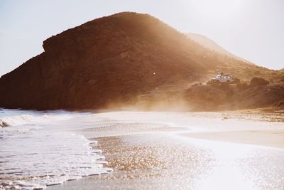 Scenic view of beach against clear sky