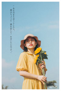 Portrait of woman standing against sky