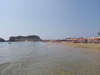 Scenic view of beach against clear sky