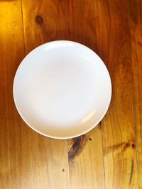High angle view of white balloon on wooden table