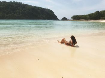 Couple sitting on beach