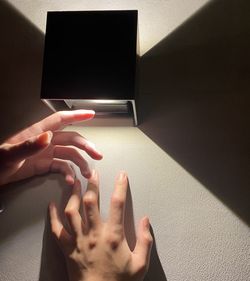 Midsection of person using mobile phone