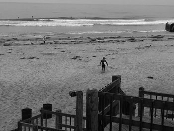 Man on beach against sky