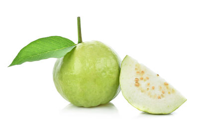 Close-up of fruits against white background