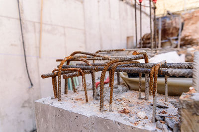 Close-up of rusty machine against wall