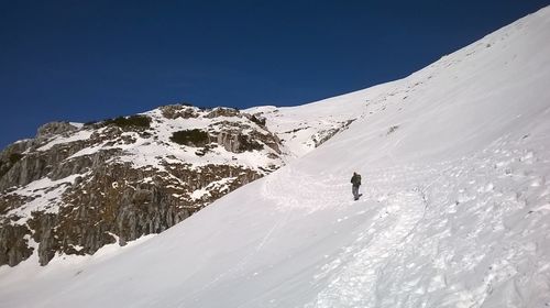 Scenic view of snowcapped mountain against clear sky