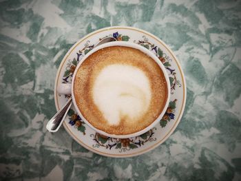 High angle view of coffee cup on table